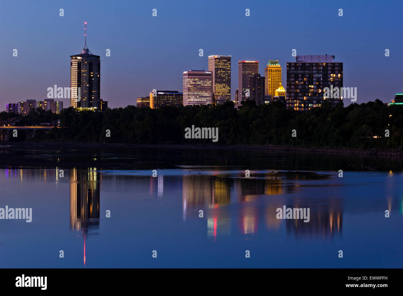 A dusk view of the Tulsa skyline, reflected in the Arkansas River Stock