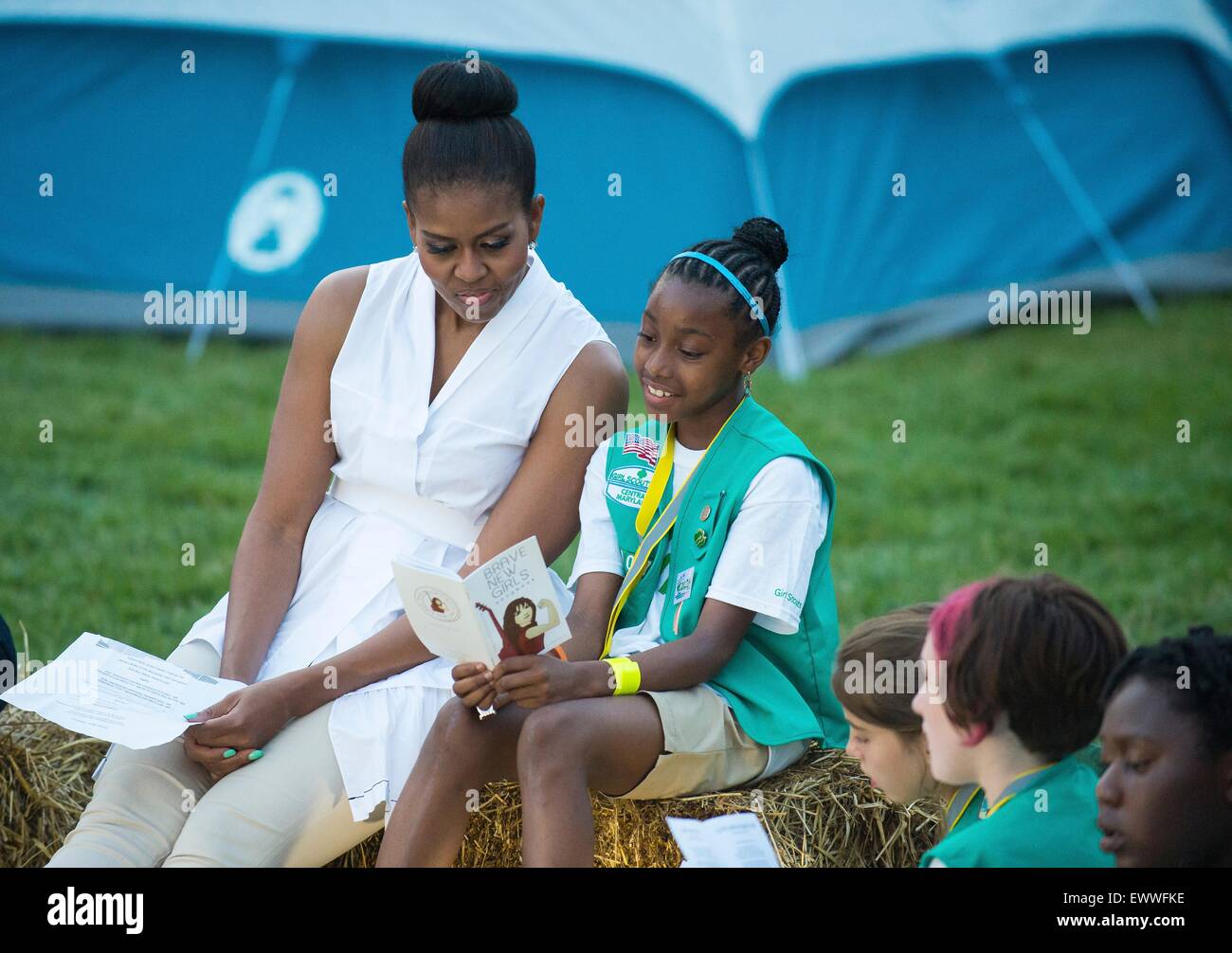 U.S. First Lady Michelle Obama talks with Girl Scouts during the first-ever White House Campout with fifty fourth-grade girls as part of the Let's Move! Outside initiative on the South Lawn of the White House June 30, 2015 in Washington, DC. In addition to the campout the girls enjoyed stargazing activity with scientists and astronaut Cady Coleman. Stock Photo