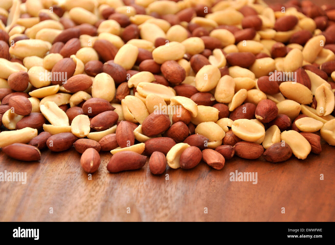Peanuts on wooden ground Stock Photo
