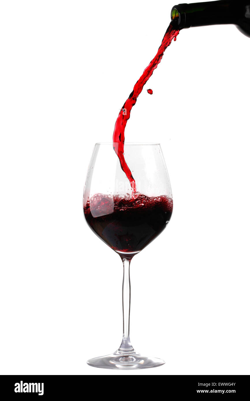 Red wine pouring from bottle into glass isolated on white background Stock  Photo - Alamy