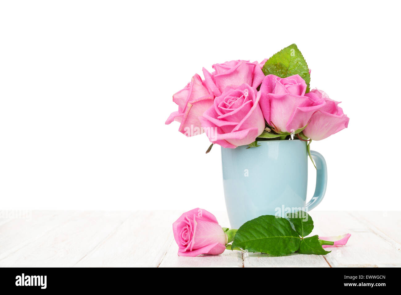 Pink roses bouquet on wooden table with copy space Stock Photo