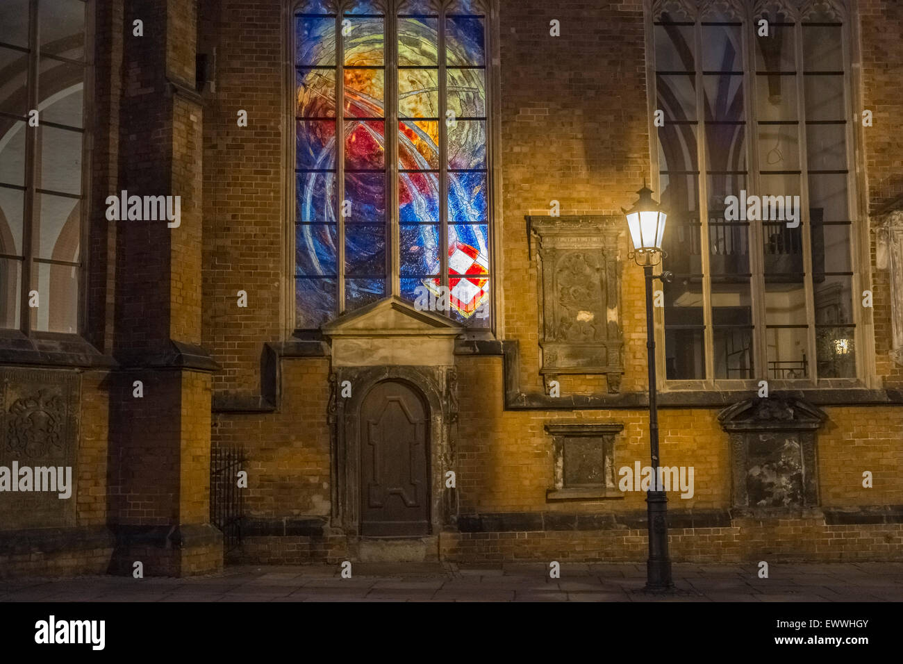 Modern stained glass church window seen at evening time, Wroclaw ...