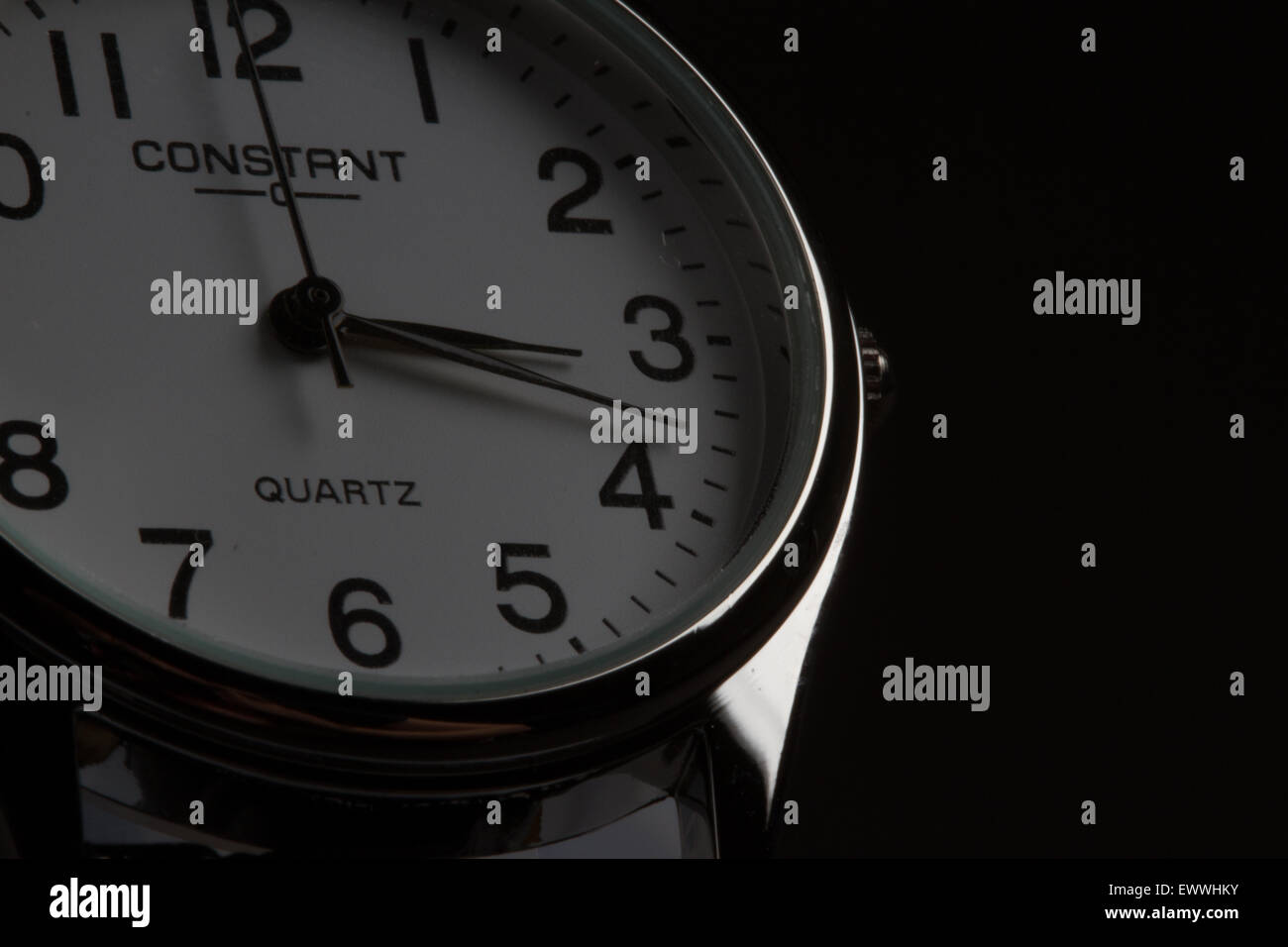 A narrow aperture shot of a Constant Silver Watch with a black background Stock Photo