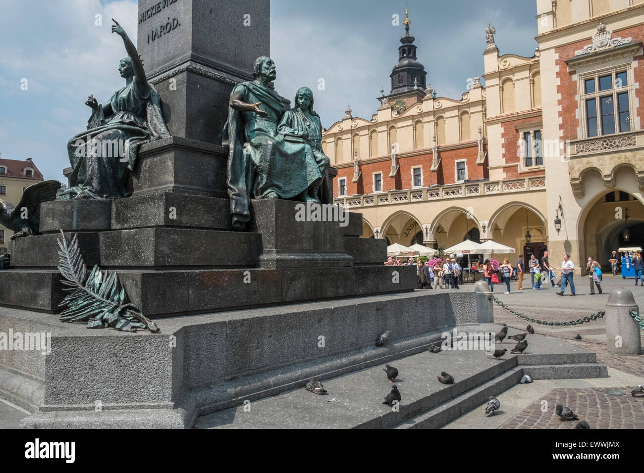 Adam Mickiewicz bronze monument in Kraków old town, with Sukiennice