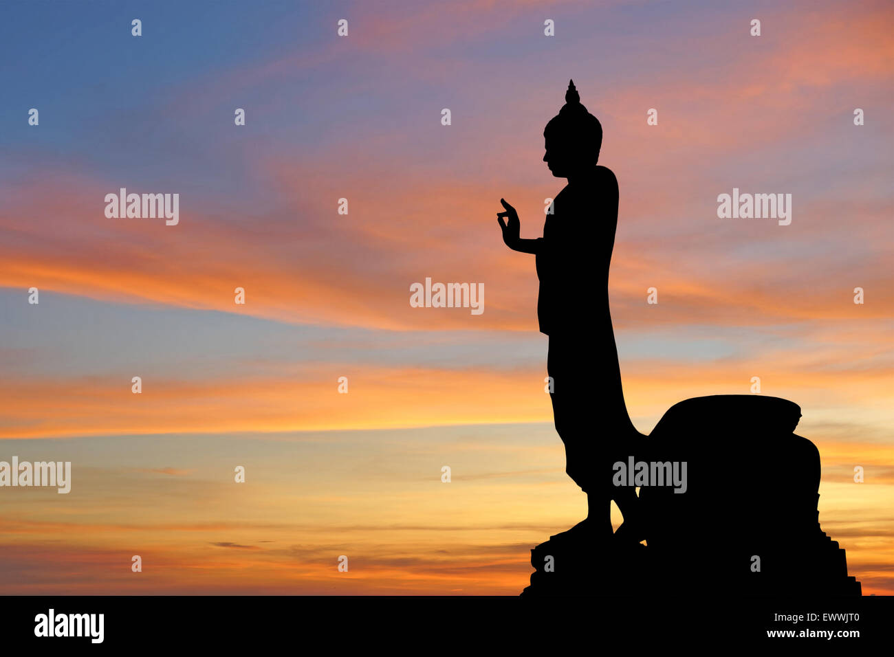 silhouette of  buddha image with beautiful sky background Stock Photo