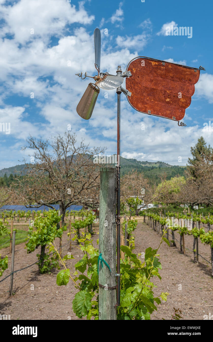 Rusty weathervane in vineyard under cloudy sky Stock Photo