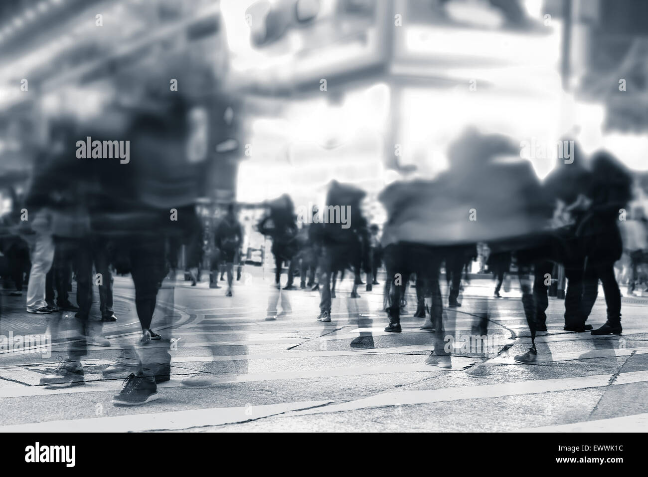 Blurred image of people moving in crowded night city street. Art toning abstract urban background. Hong Kong Stock Photo