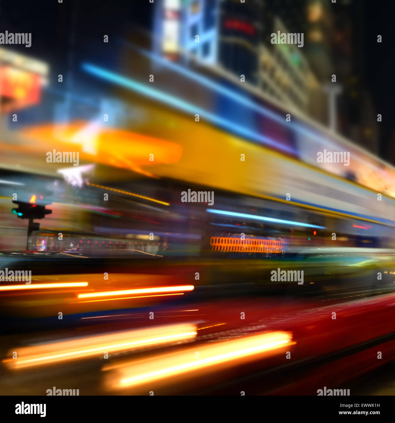 Abstract cityscape blurred background. ight view of modern city street with moving transport and illuminated skyscrapers. Hong K Stock Photo
