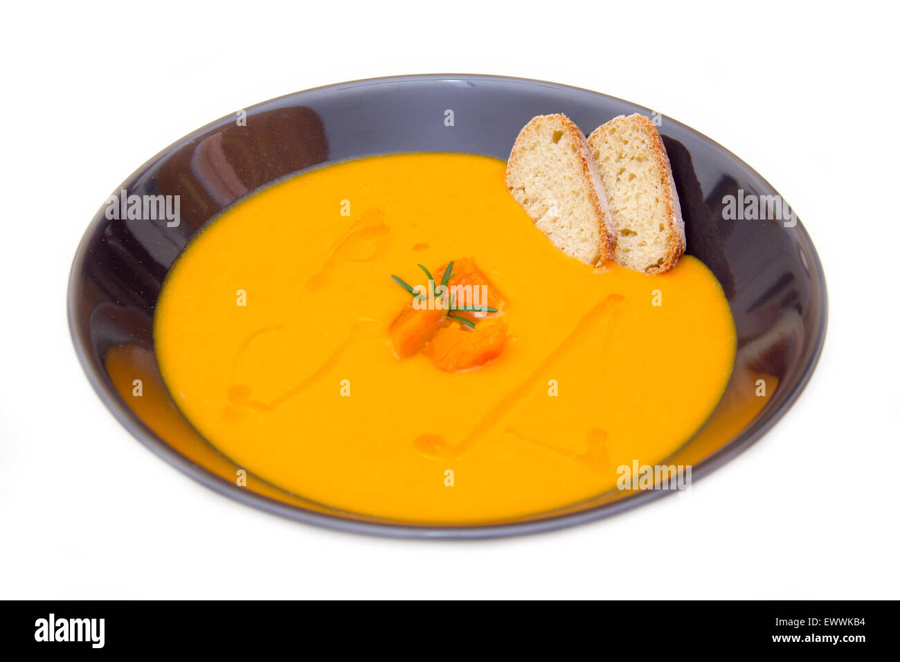 Cream of pumpkin soup with croutons on white background Stock Photo - Alamy