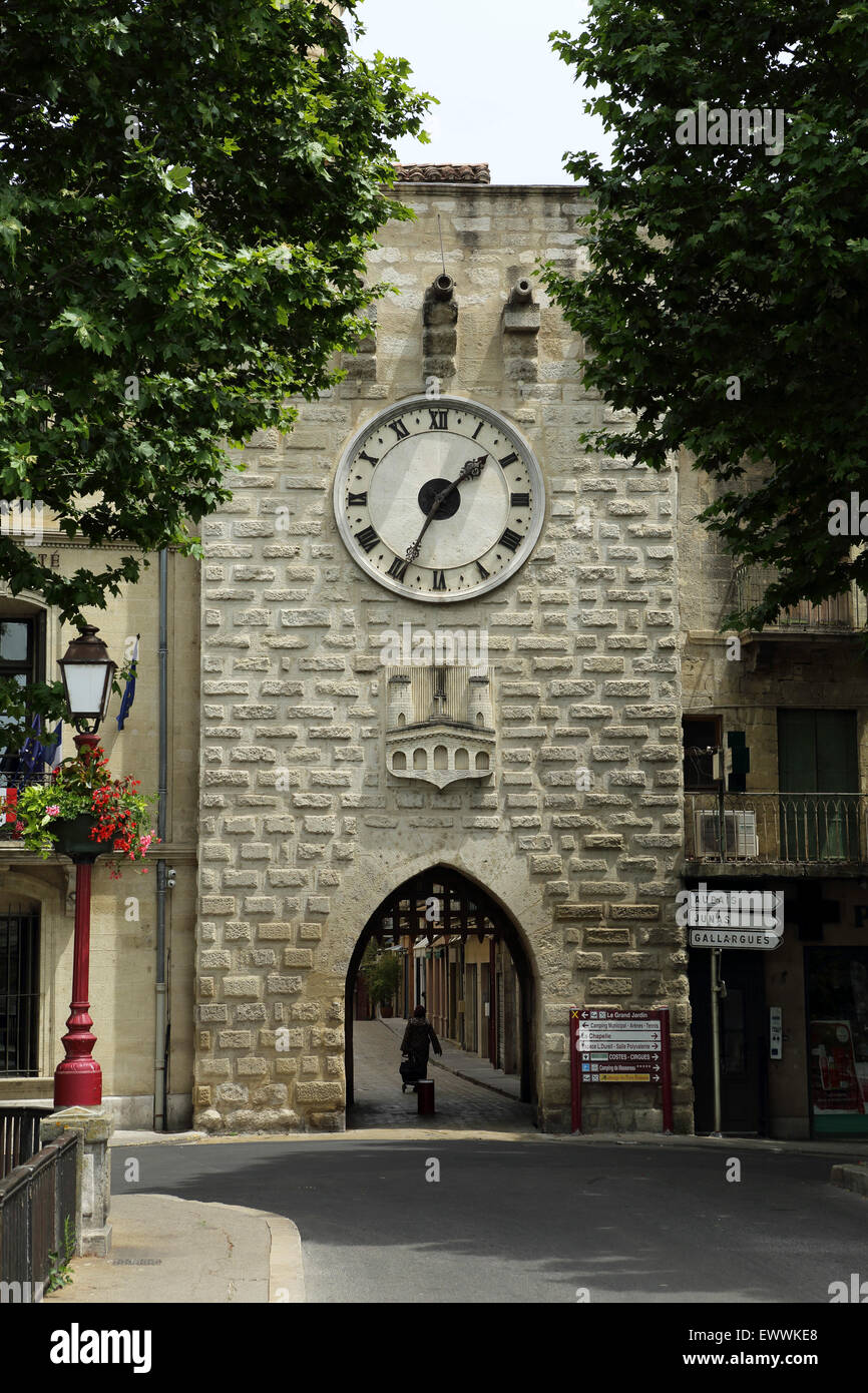 The clock tower and gate leading into Sommieres, France. Stock Photo