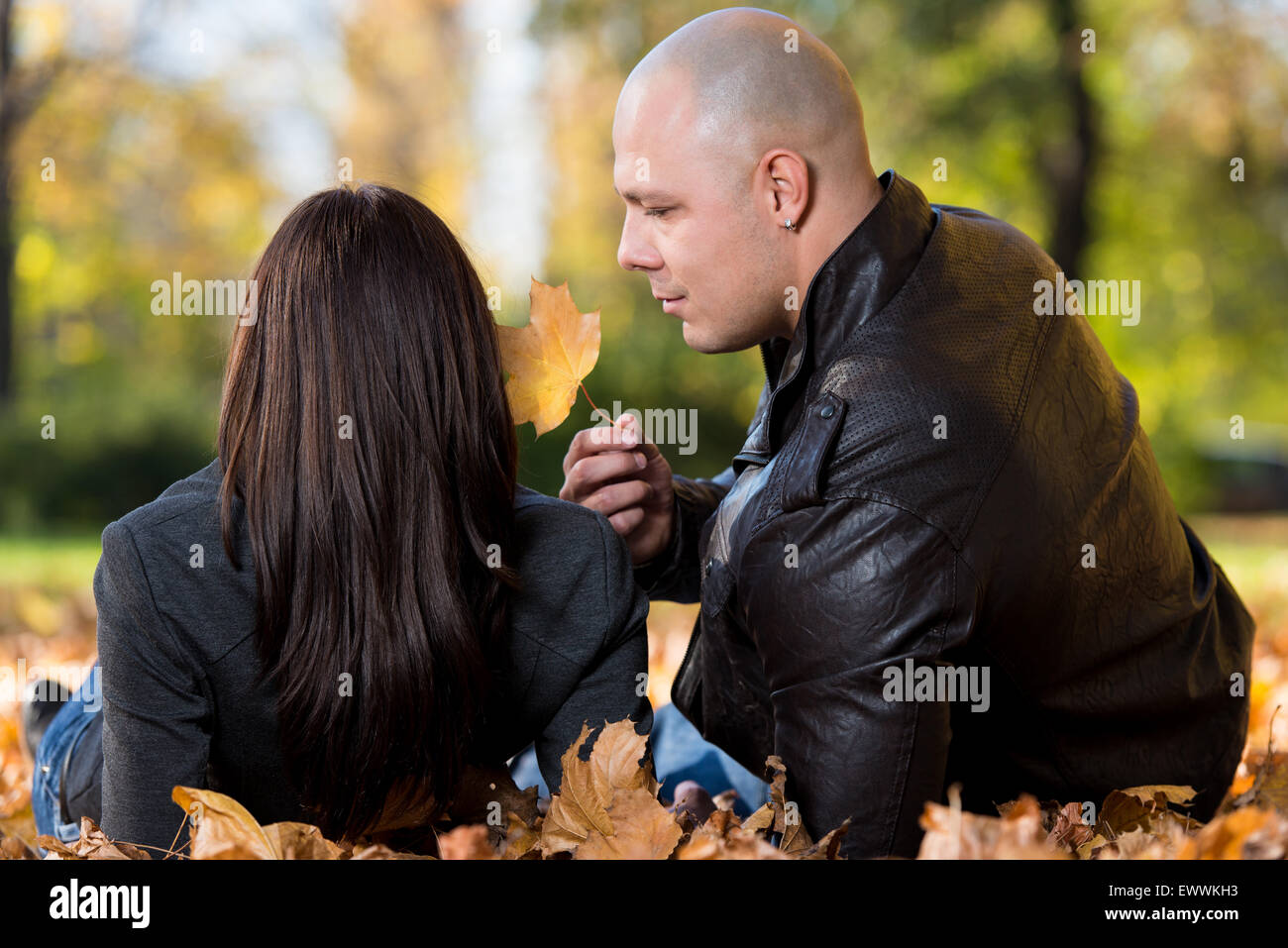 Beautiful Couple In The Park Stock Photo - Alamy