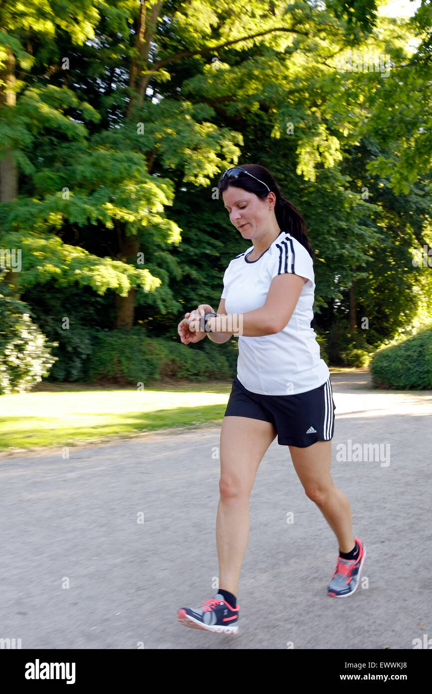 Runner controlling distance, heart rate, burned fat e.c. by a digital