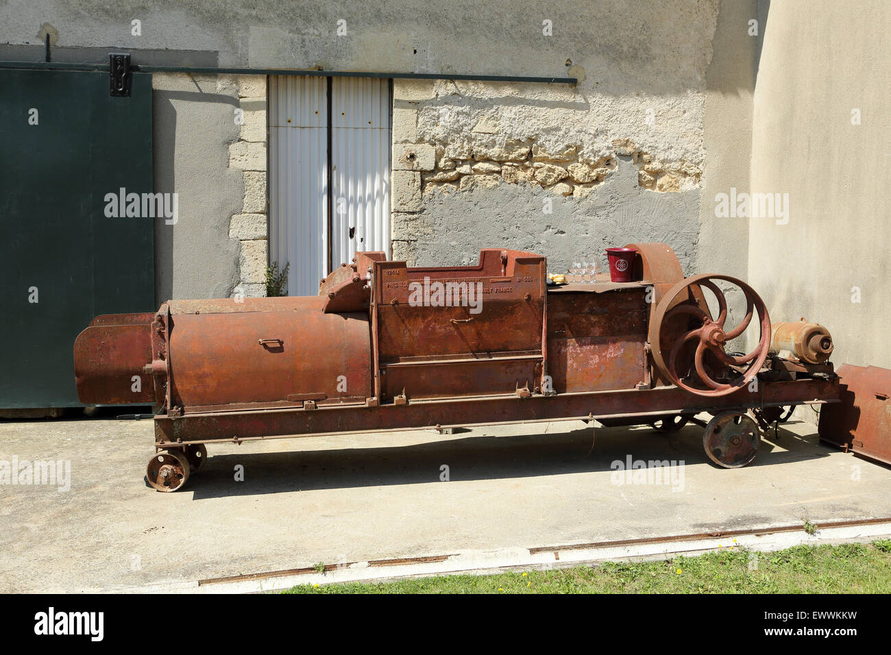 An old de-stalking machine at the Domaine de Massereau winery in Sommieres, France. The estate is in Languedoc-Roussillon. Stock Photo
