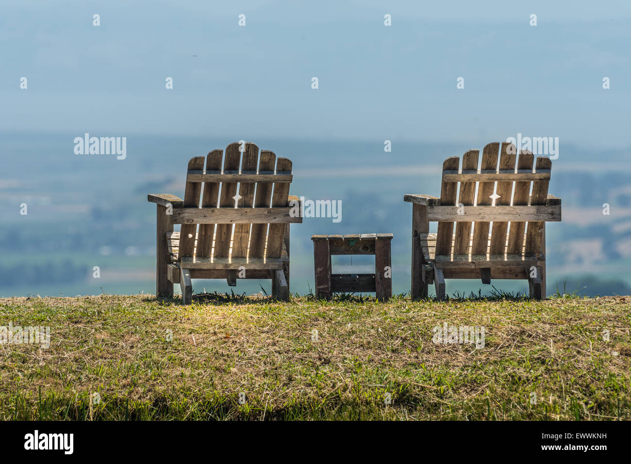 Two Adirondack chairs and small table atop hill overlooking Napa Valley Stock Photo Alamy