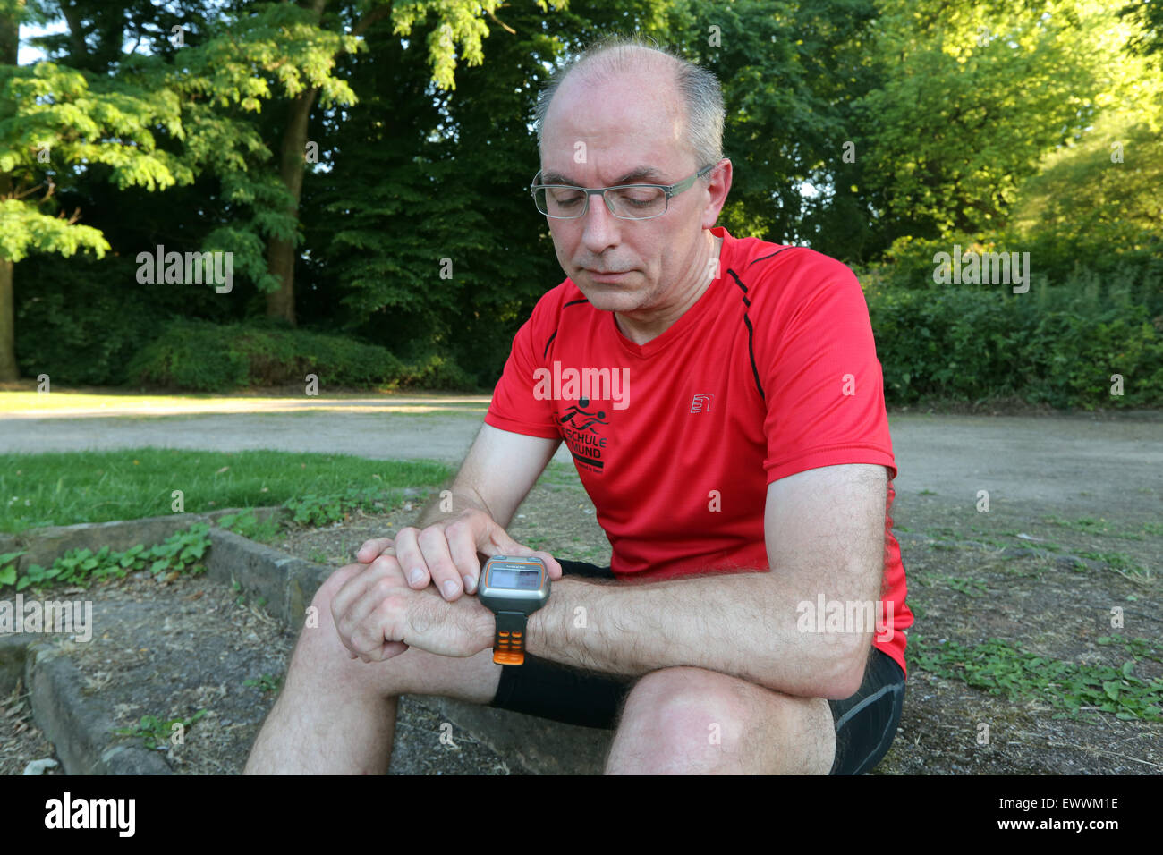 Runner controlling distance, heart rate, burned fat e.c. by a digital