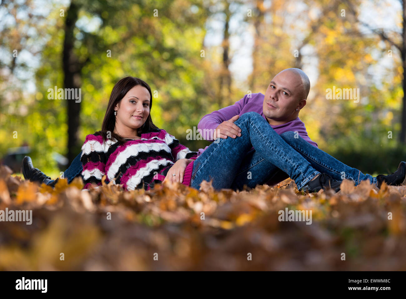 Beautiful Couple In The Park Stock Photo - Alamy