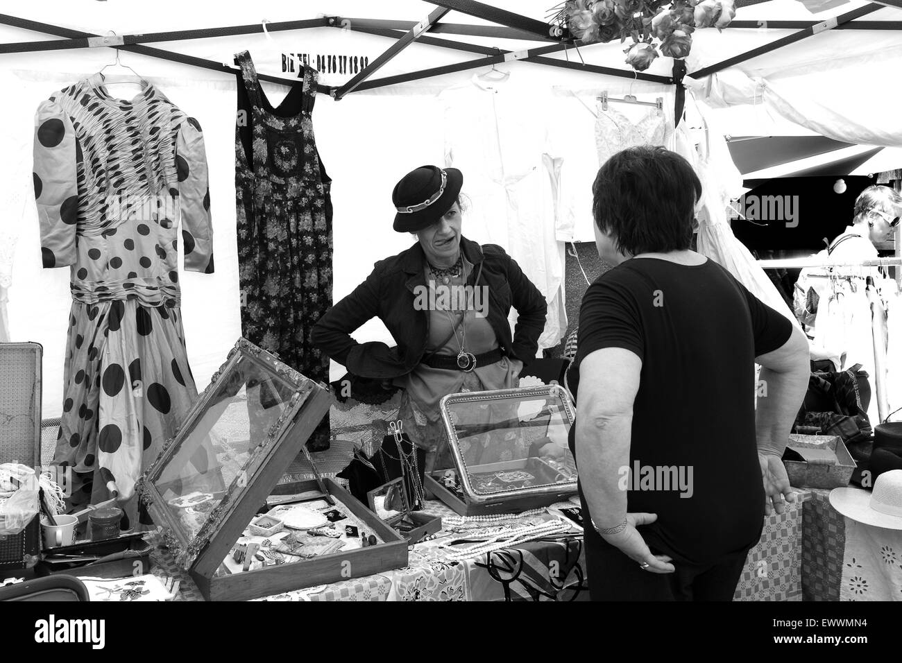 French market stall holder  selling ladies fashion wear at Annecy market in France french Stock Photo