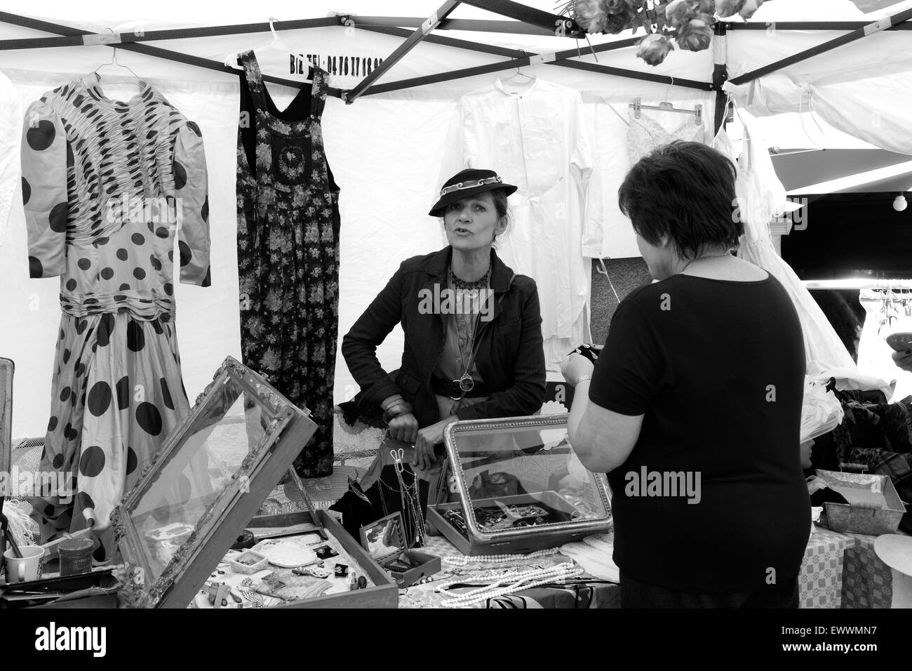 French market stall holder selling ladies fashion wear at Annecy market in France french Stock Photo