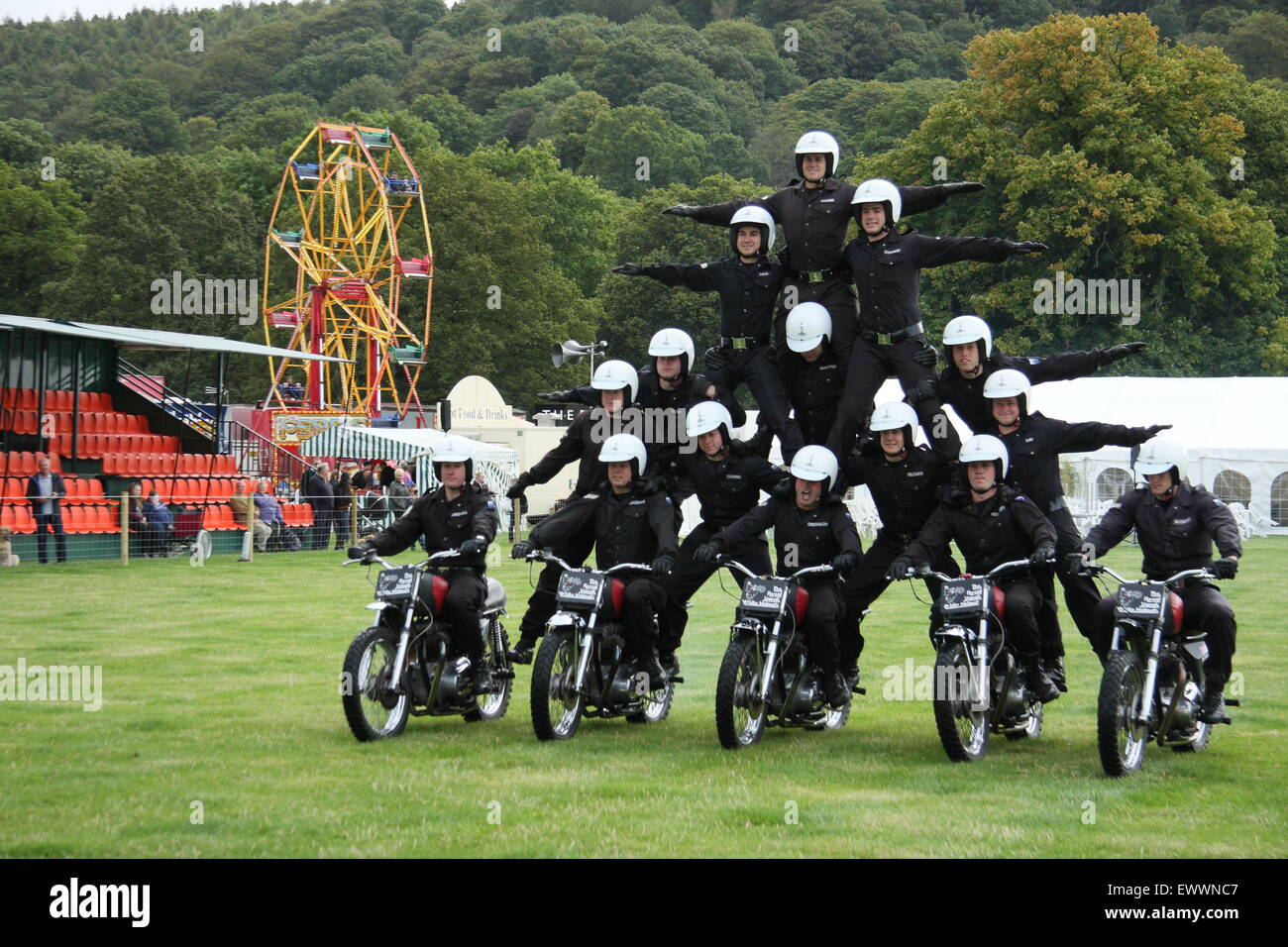 The Royal Signals White Helmets Motorcylcle display team perform at Chatsworth Country Fair, Peak District Derbyshire England UK Stock Photo