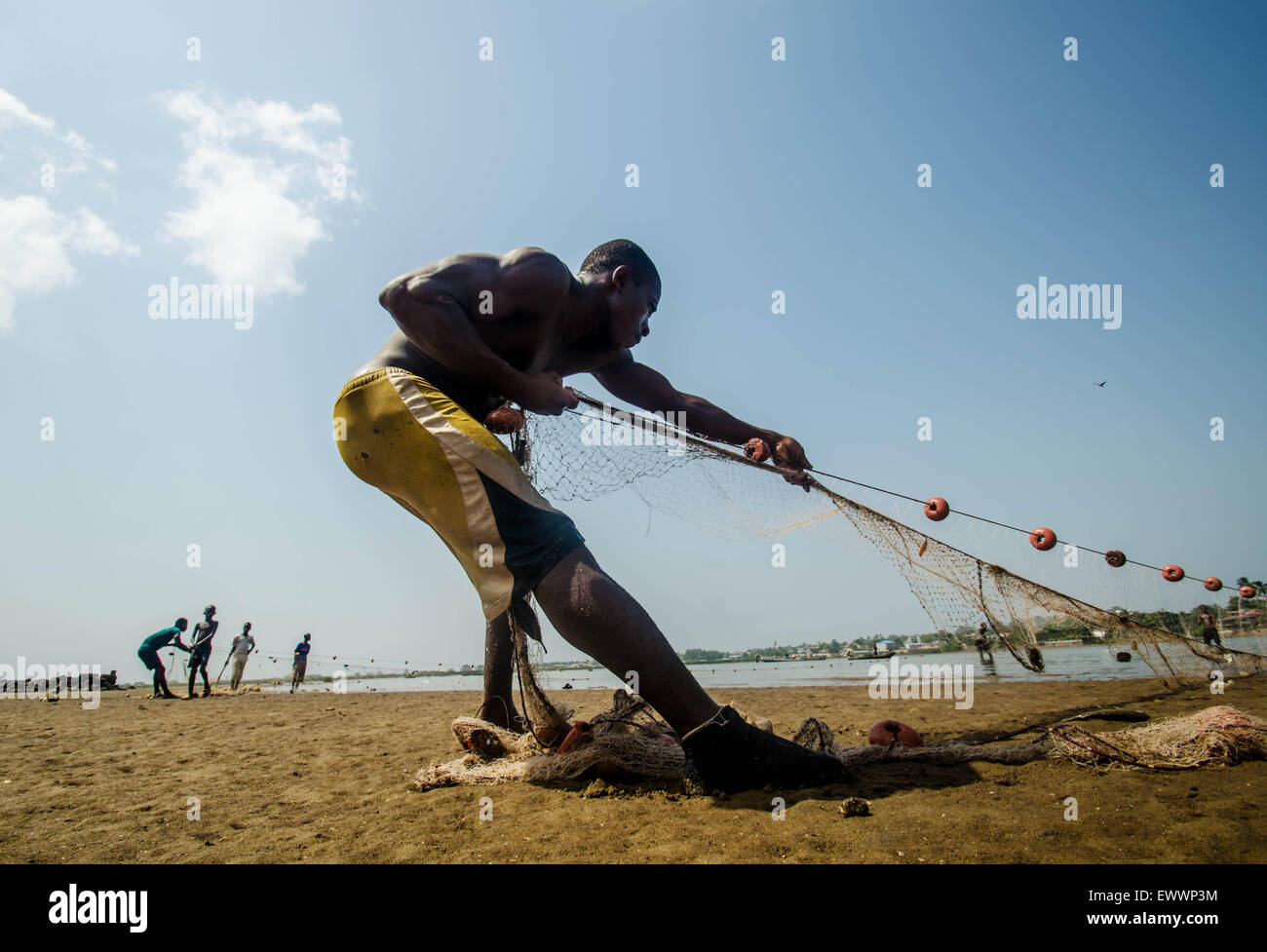 Fishing at a beach outside Freetown in Sierra Leone Stock Photo