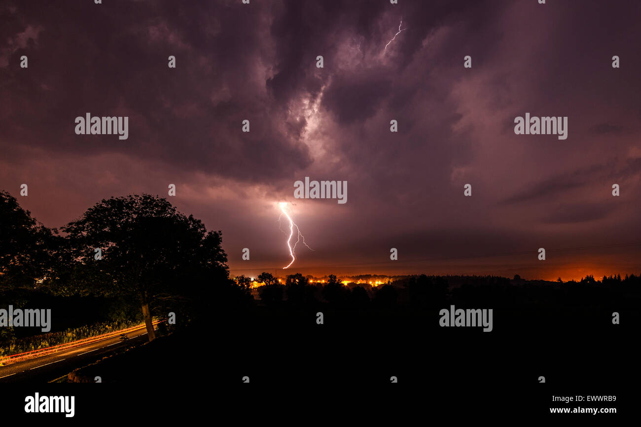 Barnard Castle, Teesdale, County Durham UK. 2nd July, 2015. UK weather. Thunderstorms have continued to affect Northern England overnight. Here lightning streaks across the sky and strikes the high ground surrounding the town. . Credit:  David Forster/Alamy Live News Stock Photo