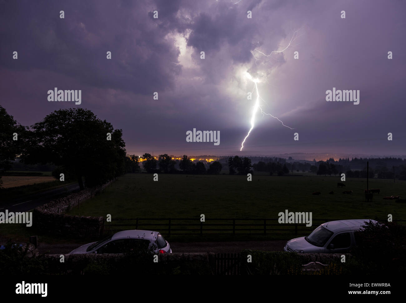 Barnard Castle, Teesdale, County Durham UK. 2nd July, 2015. UK weather. Thunderstorms have continued to affect Northern England overnight. Here lightning streaks across the sky and strikes the high ground surrounding the town. . Credit:  David Forster/Alamy Live News Stock Photo
