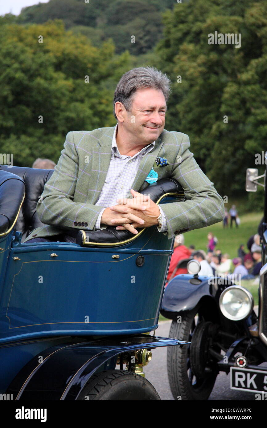 TV presenter and author, Alan Titichmarsh takes a passengers seat in the classic car drive a Chatsworth Country Fair, England UK Stock Photo