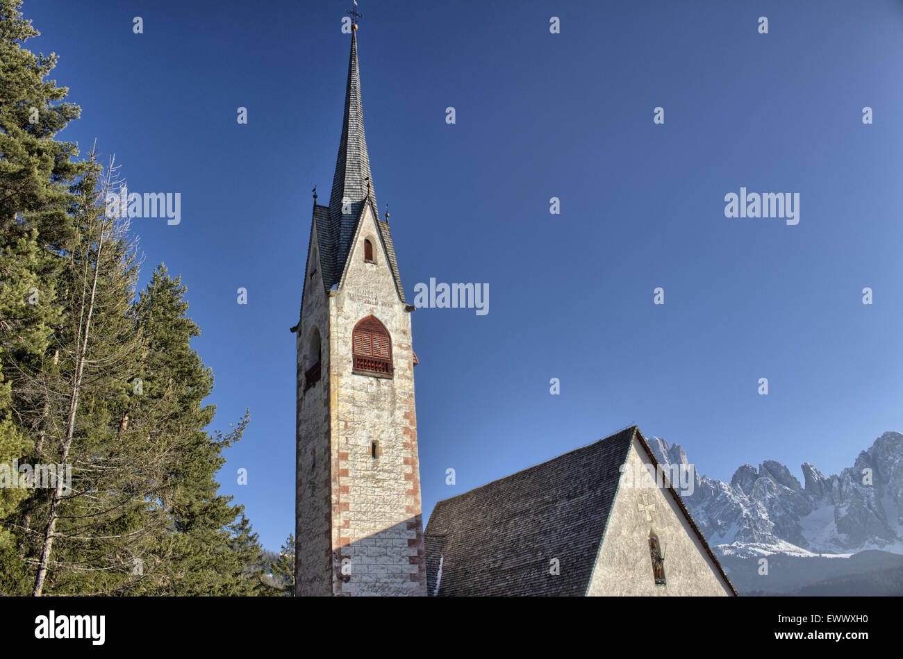 St. Jacob’s Church overlooking pine forests and snow-capped peaks of ...