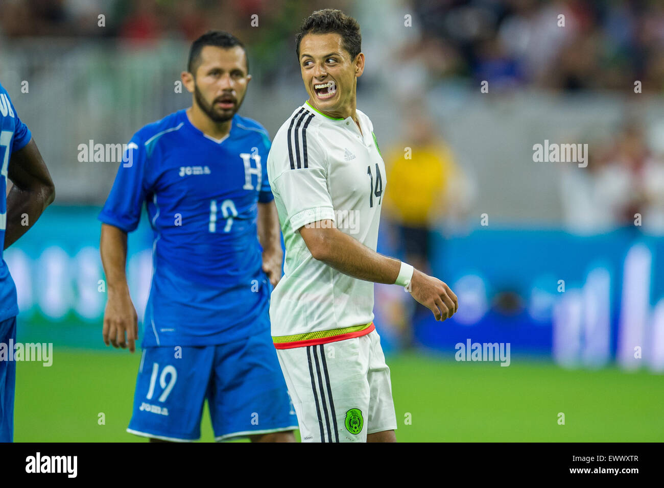 Houston, TX, USA. 1st July, 2015. Mexico forward Javier Hernandez (14) smiles at a teammate during the 1st half of an international soccer match between Honduras and Mexico at NRG Stadium in Houston, TX. Trask Smith/CSM/Alamy Live News Stock Photo
