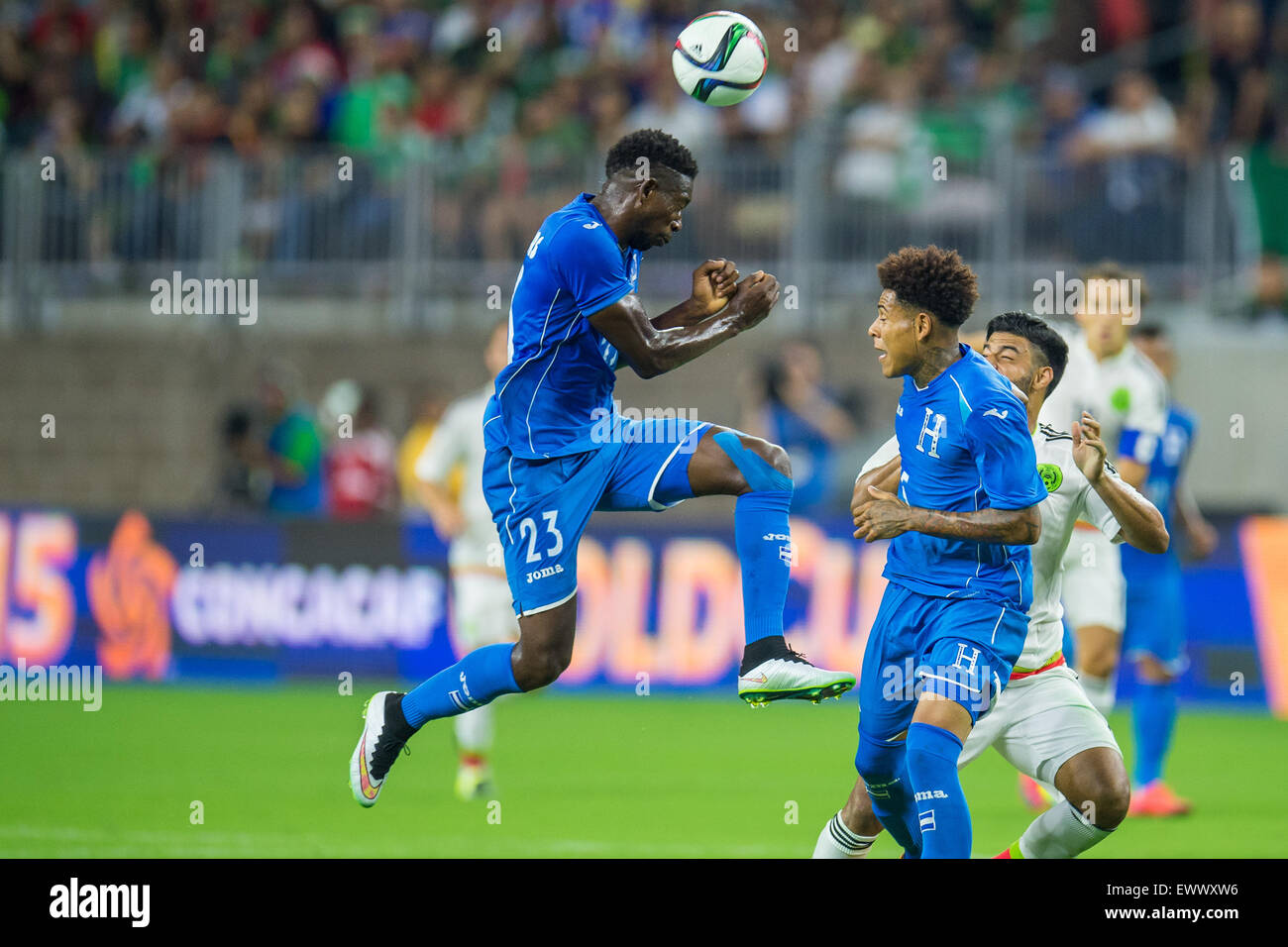 Houston, TX, USA. 1st July, 2015. Honduras defender Johnny Palacios (23) heads the ball during the 1st half of an international soccer match between Honduras and Mexico at NRG Stadium in Houston, TX. Trask Smith/CSM/Alamy Live News Stock Photo