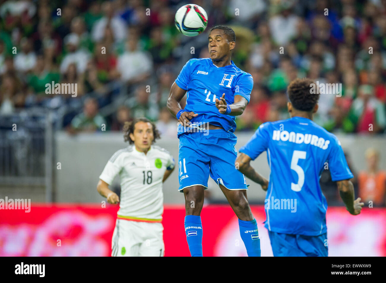 Houston, TX, USA. 1st July, 2015. Honduras defender Brayan Beckeles (21) heads the ball during the 1st half of an international soccer match between Honduras and Mexico at NRG Stadium in Houston, TX. Trask Smith/CSM/Alamy Live News Stock Photo