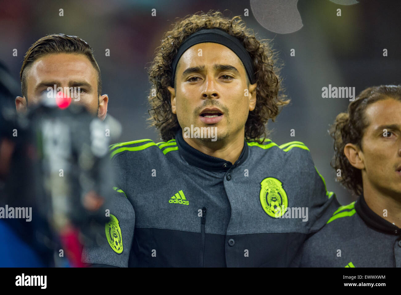 Houston, TX, USA. 1st July, 2015. Mexico goalkeeper Guillermo Ochoa (13) signs the national anthem prior to an international soccer match between Honduras and Mexico at NRG Stadium in Houston, TX. Trask Smith/CSM/Alamy Live News Stock Photo