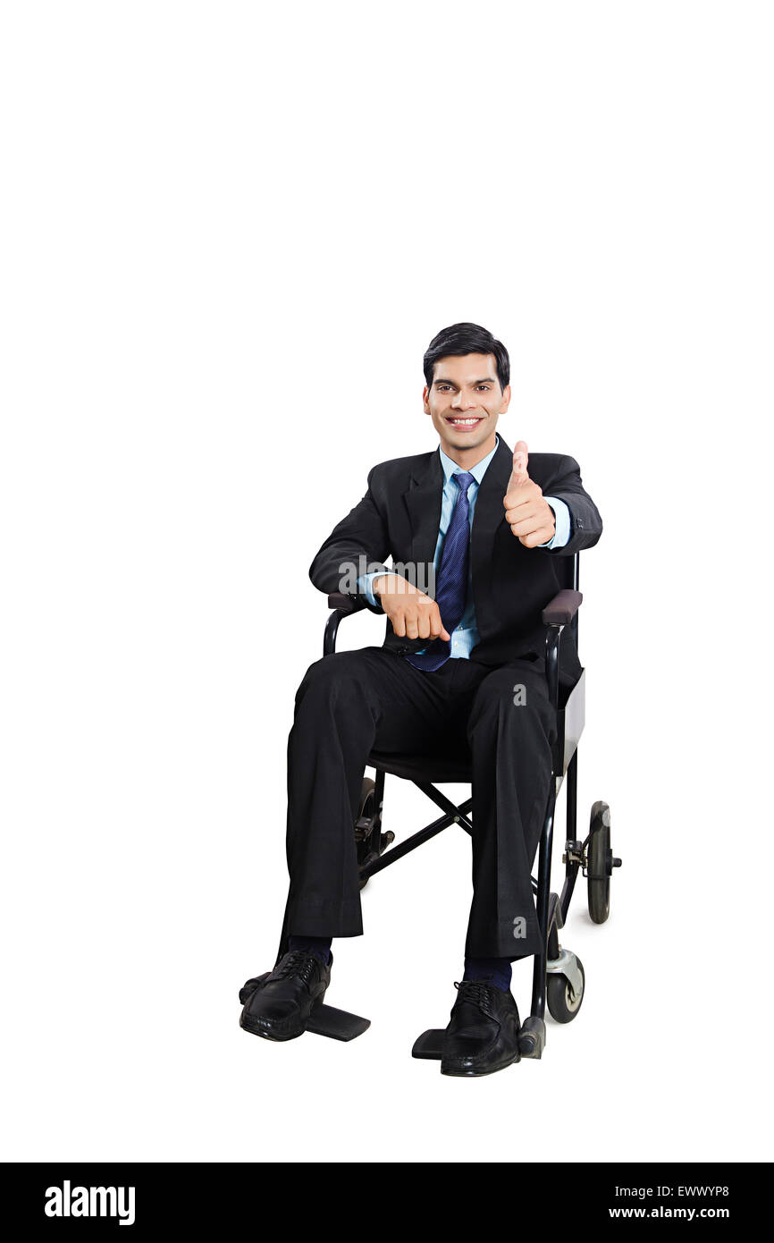 1 indian Business man Patient Wheelchair Sitting Thumbs Up showing Stock Photo