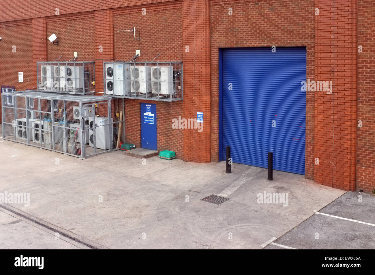 Temperature controlled refrigeration equipment and distribution loading area at the rear of a retail Frozen Food Outlet. Stock Photo