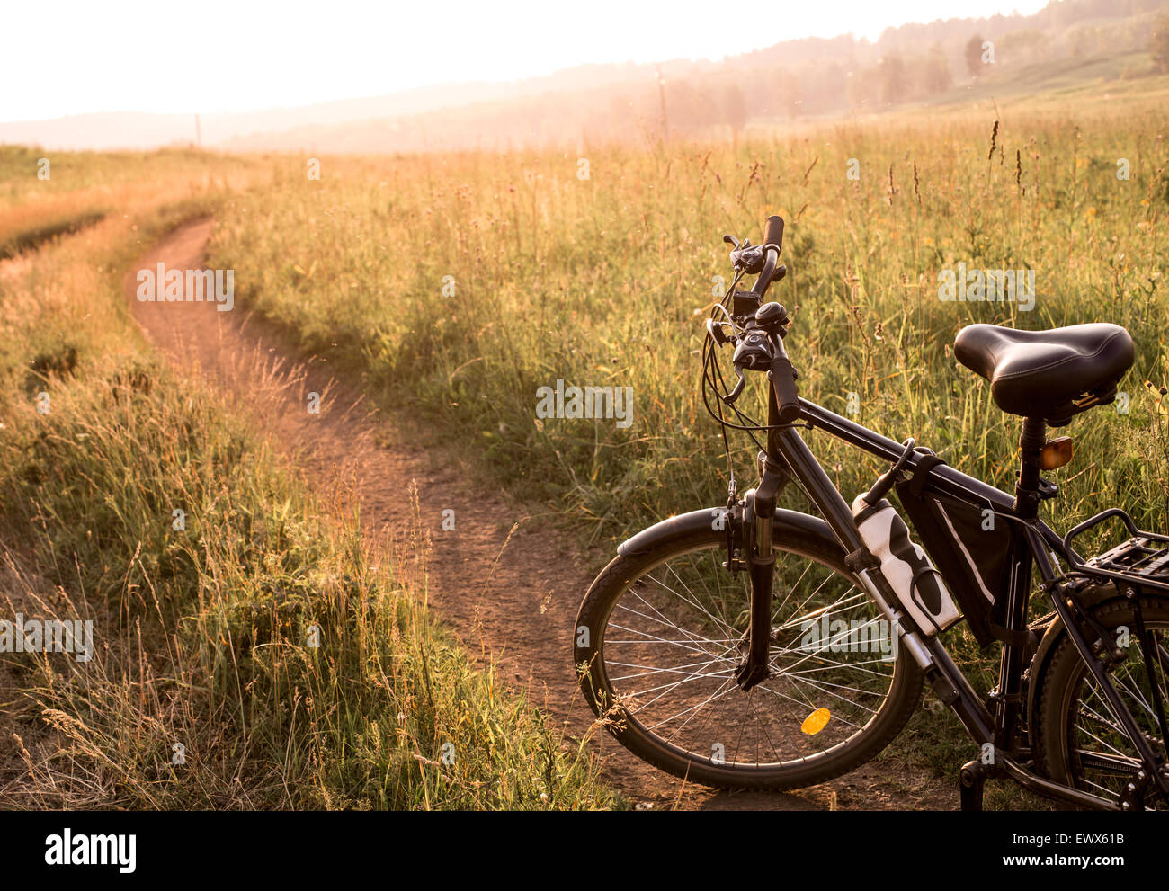 black country bicycle at sunrise or sunset Stock Photo