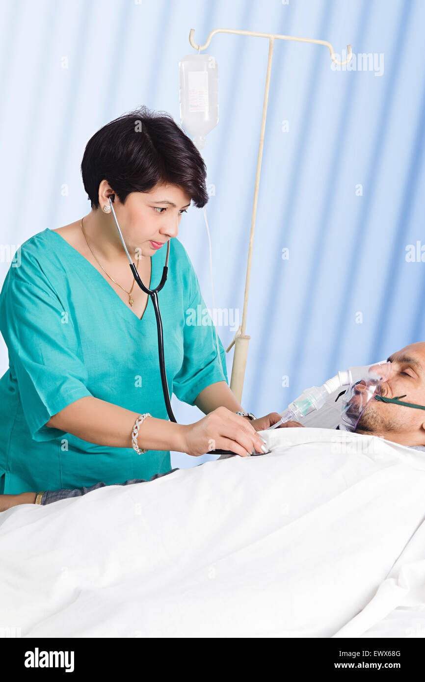 indian Doctor Patient Checking Stock Photo