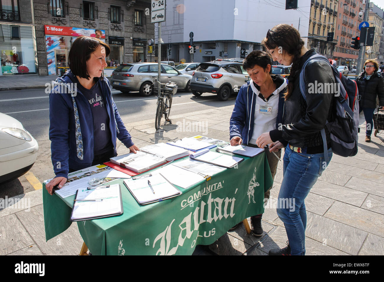 MILAN, ITALY - MARCH 18, 2015: On the streets of the city. Signature collectors on Corso Buenos Aires. Stock Photo