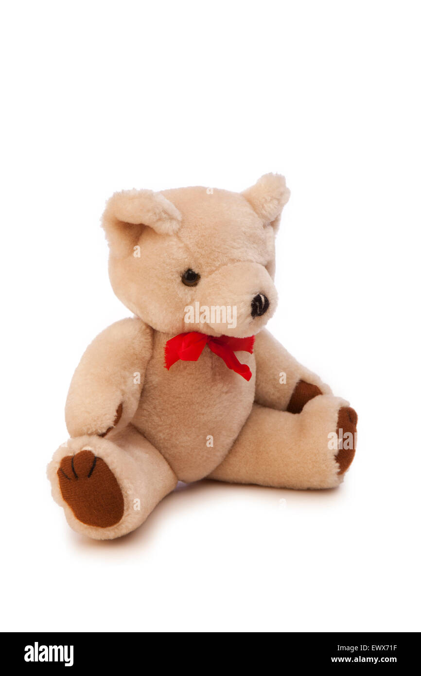 toys, child’s teddy bear with red ribbon round neck Stock Photo