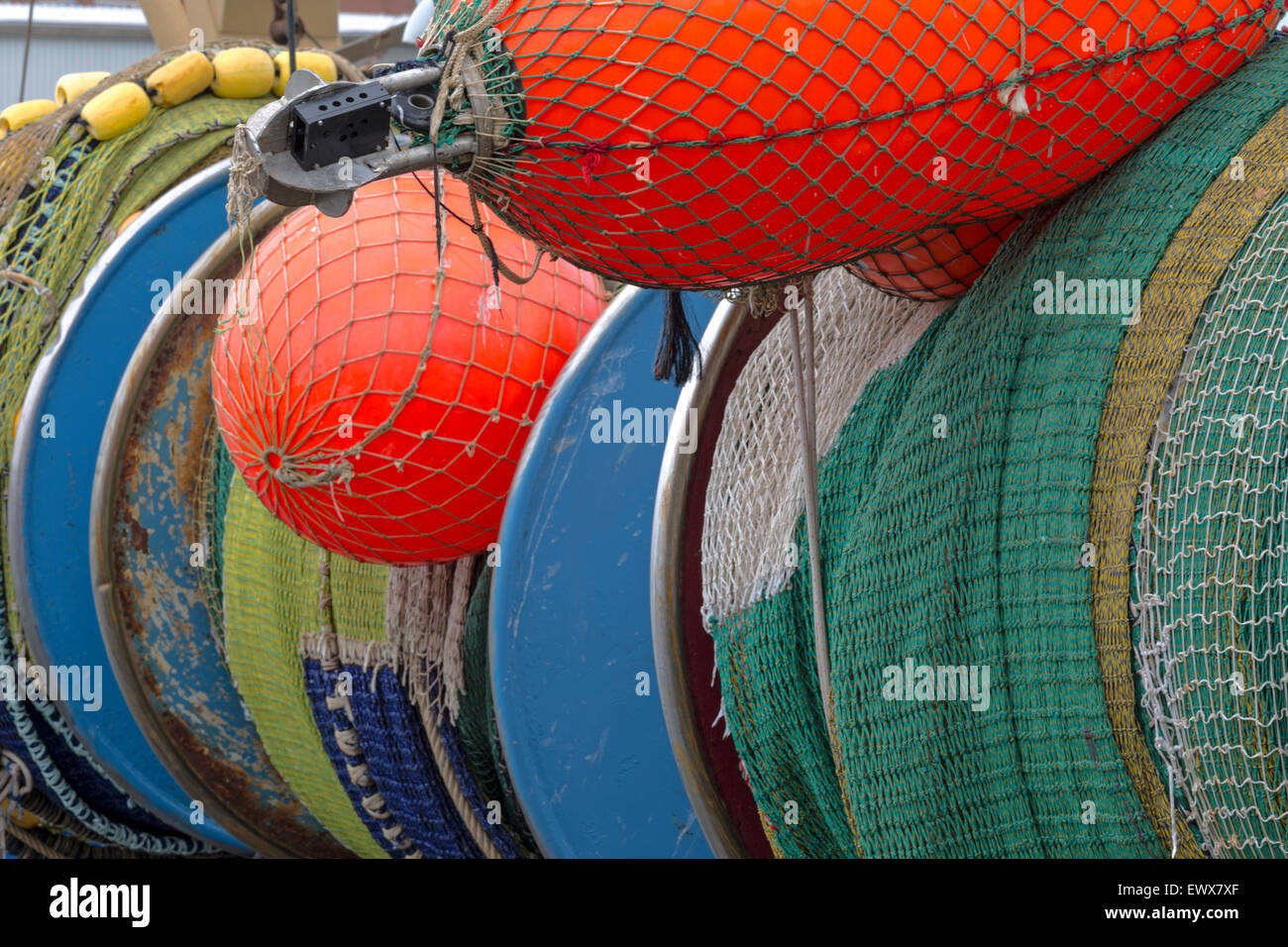 Still life of fishing gear, such as colorful nets, buoys and floats in