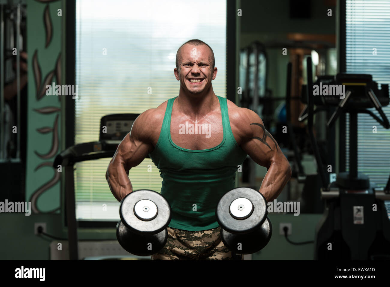 Young Man Preforming Dumbbell Lateral Raise - Exercise For Shoulders ...