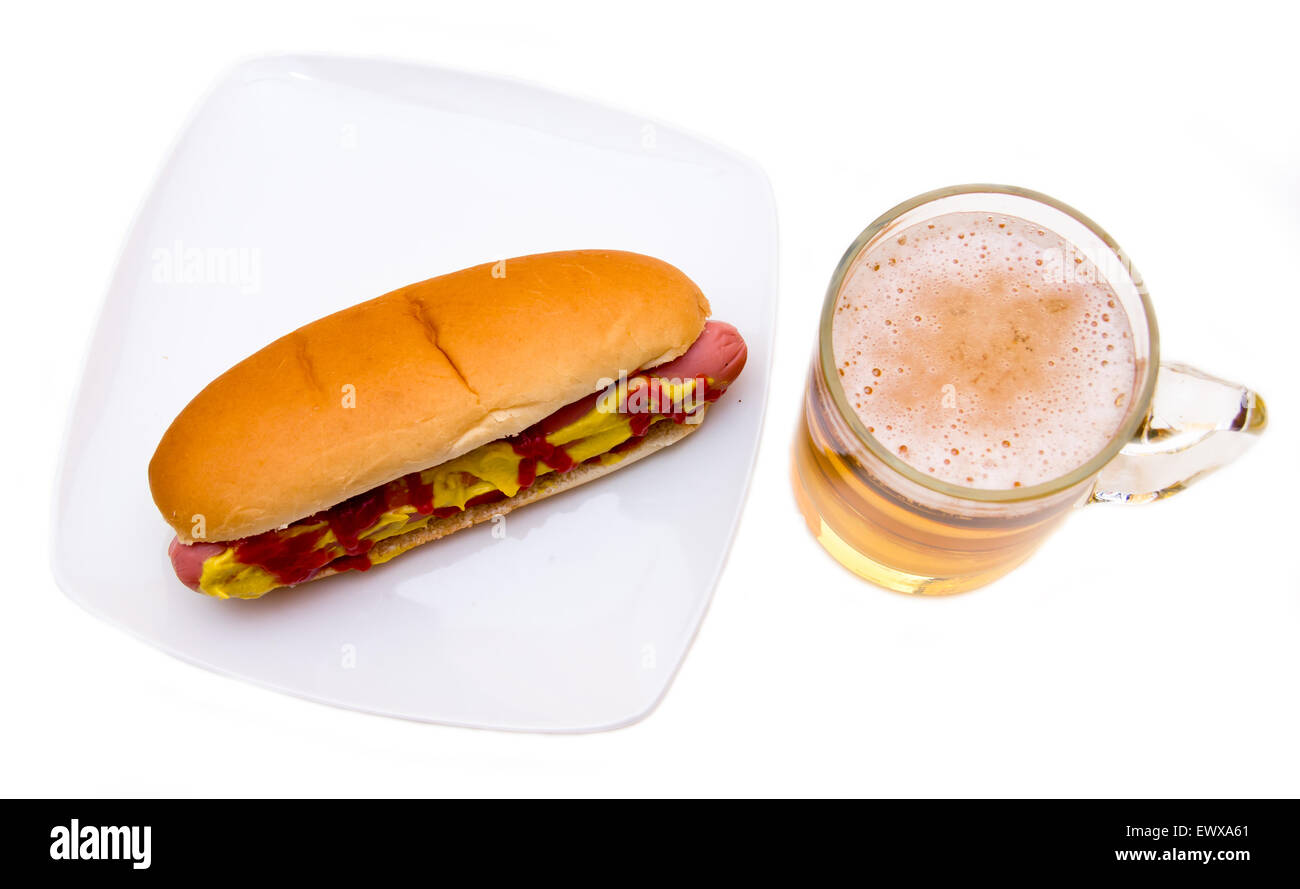 Beer and hot dogs on a white background seen from above Stock Photo