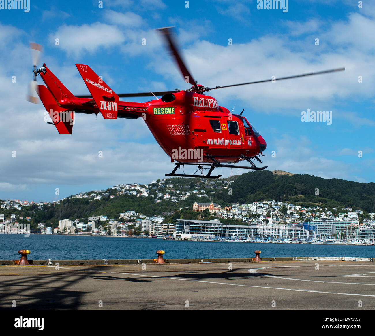 Helicopter coming in to land at the waterfront in Wellington, New Zealand. Stock Photo