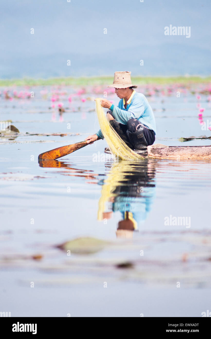 Man fishing on Phayao Lake in Thailand, Asia. Stock Photo