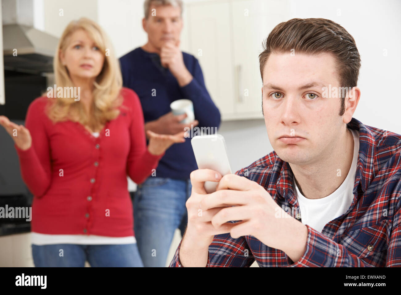 Mature Parents Frustrated With Adult Son Living At Home Stock Photo - Alamy
