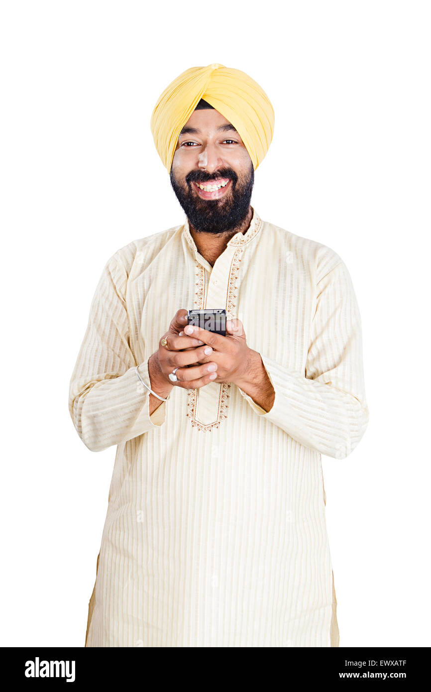 1 indian Punjabi man dialing Cell Phone Stock Photo