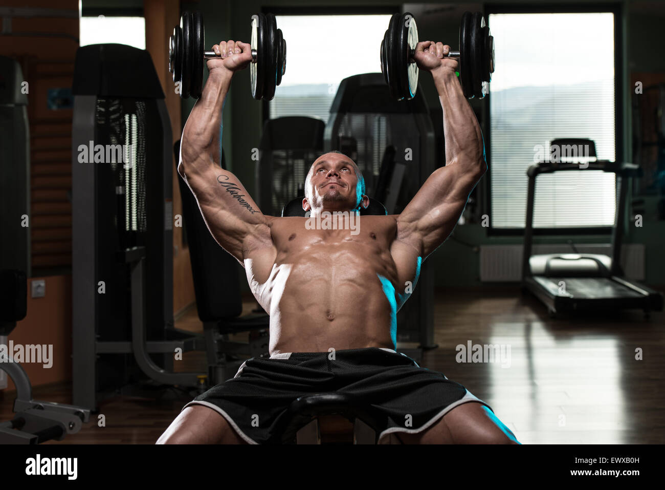 Handsome Young Man Doing Dumbbell Incline Bench Press Workout In
