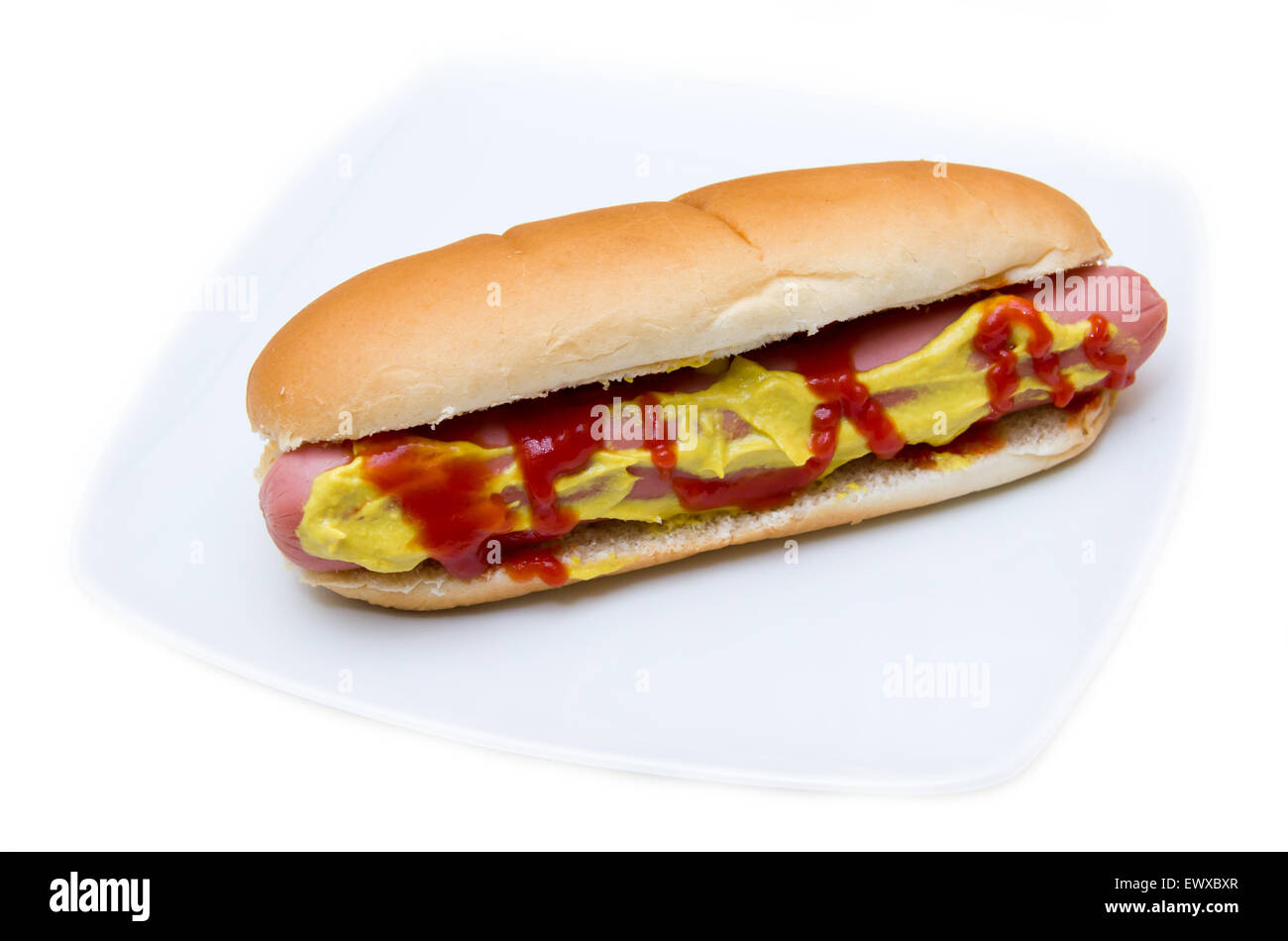 Hot dog on plate on white background Stock Photo - Alamy