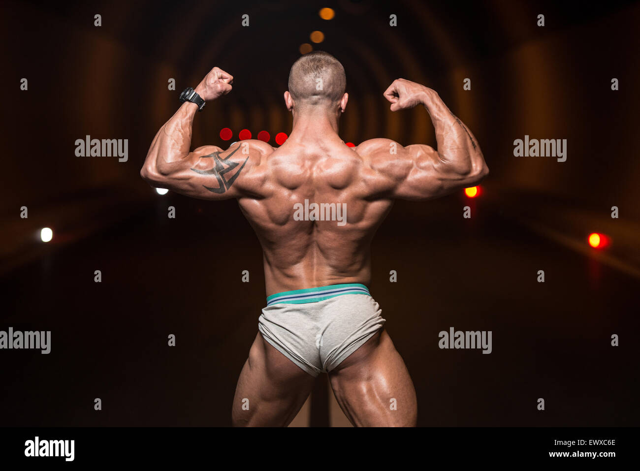 Athletic Sports Bodybuilder Demonstrates Posture from the Back Stock Photo  - Image of athletic, professional: 47496722