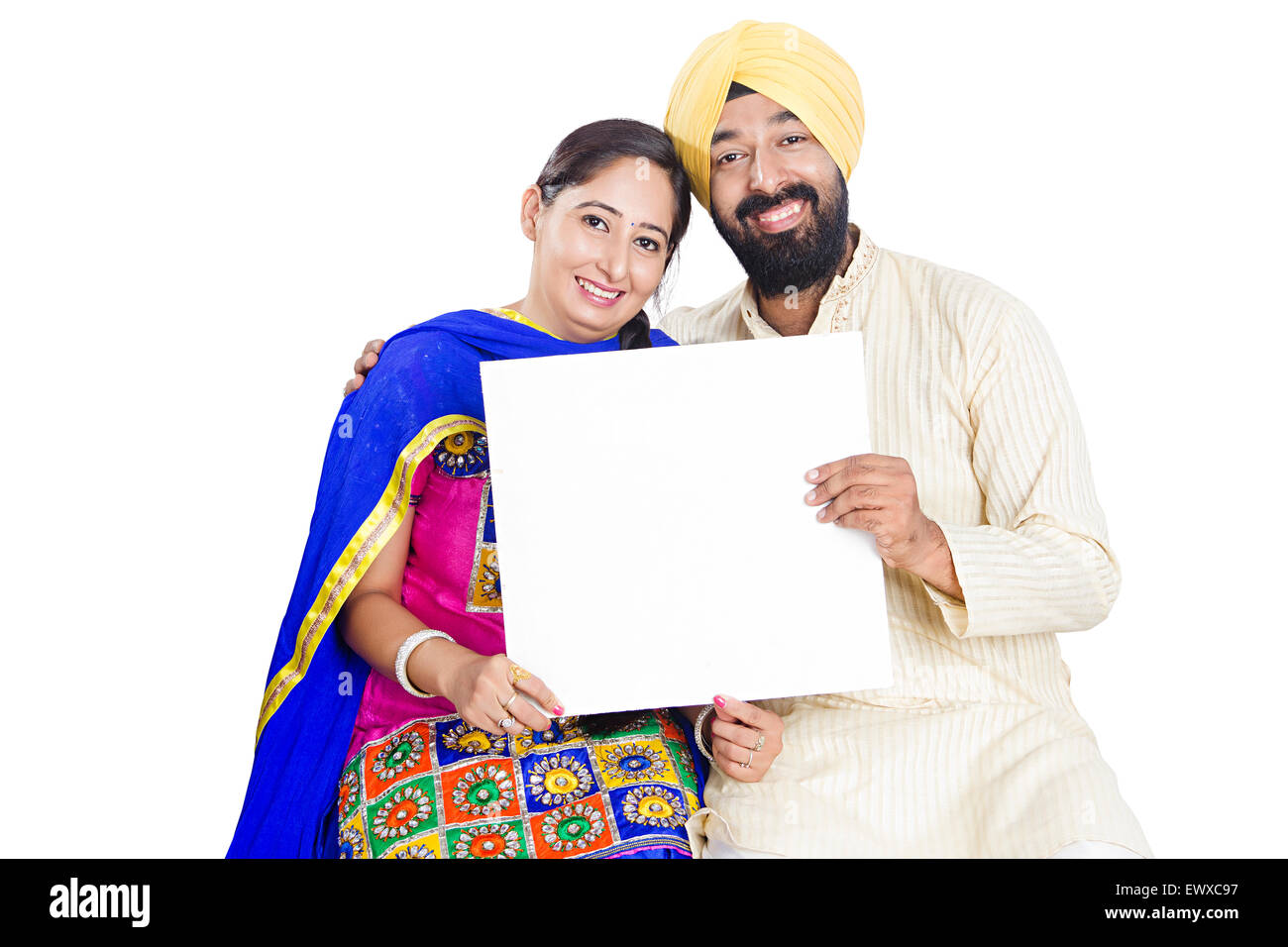 2 indian Punjabi Married Couple showing Message Board Stock Photo - Alamy