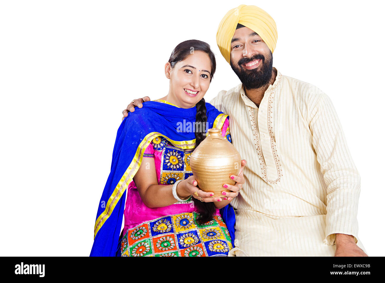2 indian Punjabi Married Couple Saving money Piggy Bank Stock Photo - Alamy